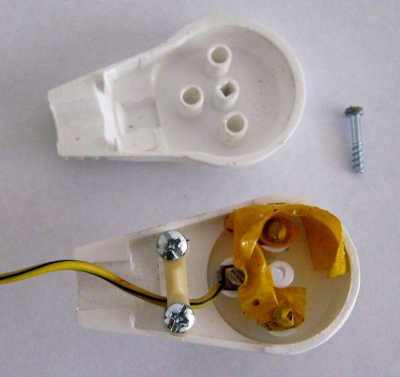 The insulation insde a power plug of a simple homemade device for grounding (earthing)